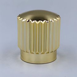 gold cologne bottle cap